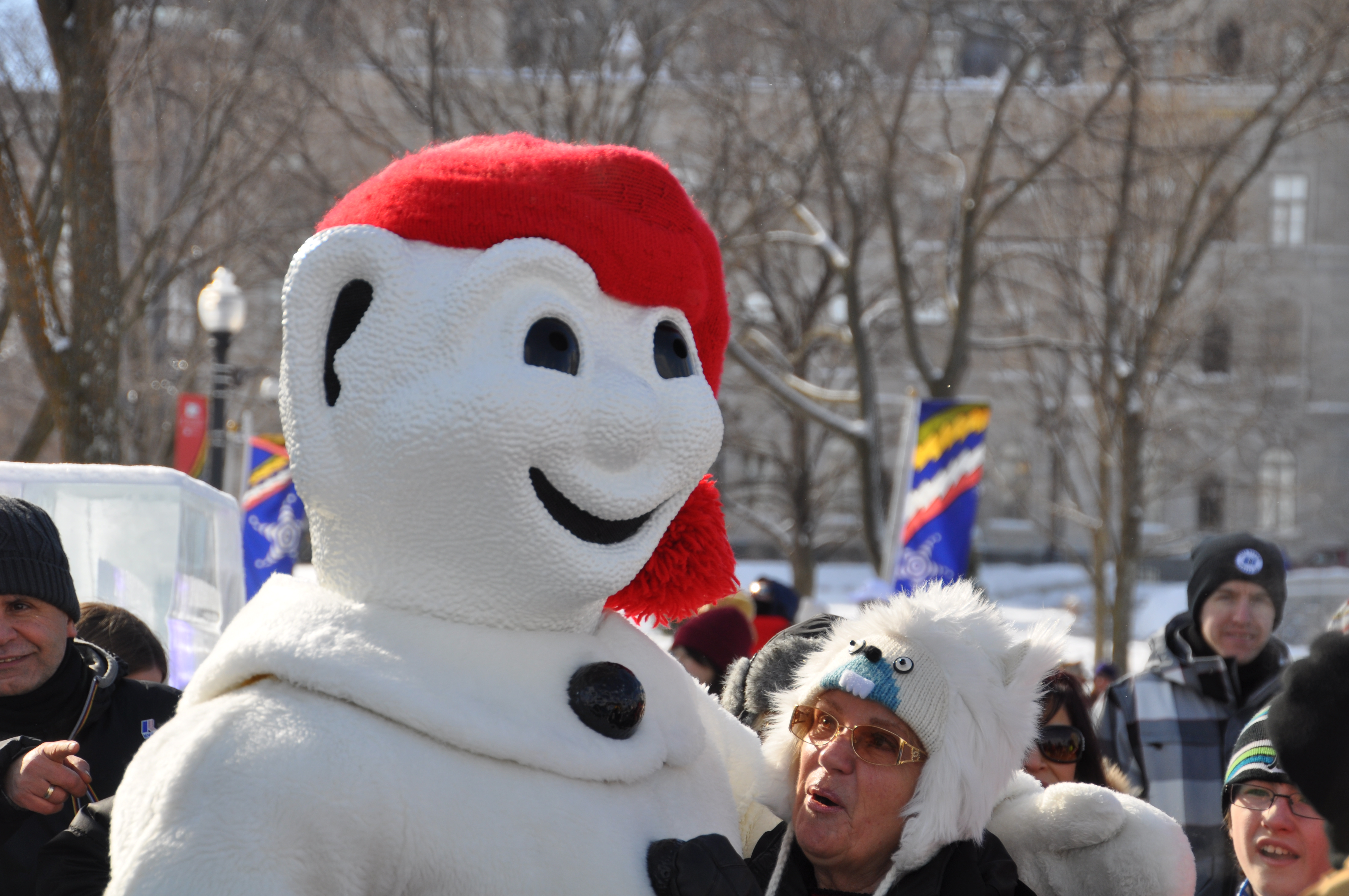Bonhomme Carnaval wearing his red toque and arrow sash in Quebec City
