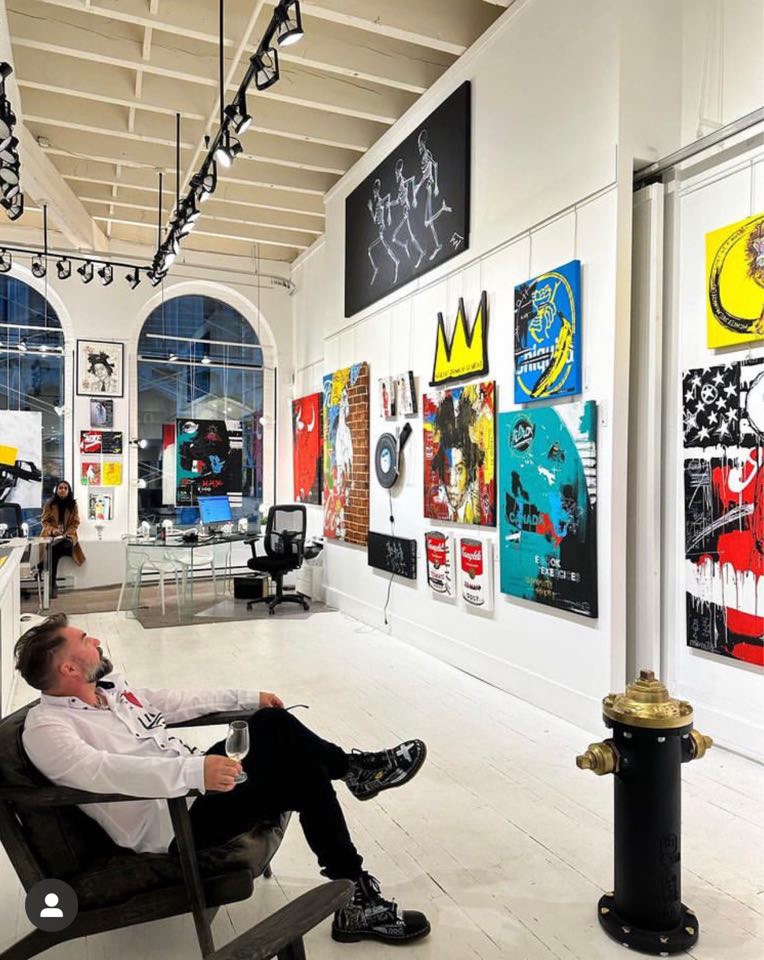 Quebec artist Sébastien Larochelle with his work