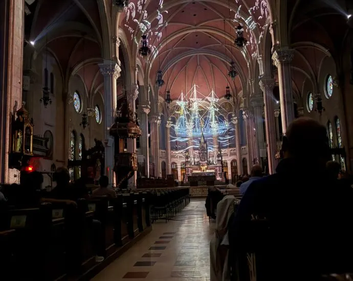 AURA light projections illuminating the interior of Saint-Roch Church in Quebec City