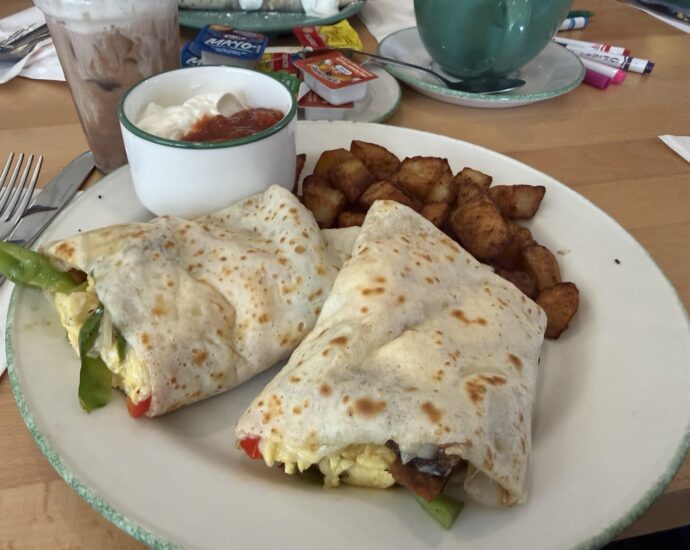 Cora crêpe burrito with eggs, vegetables, black bean patty, potatoes, salsa and sour cream in Quebec City