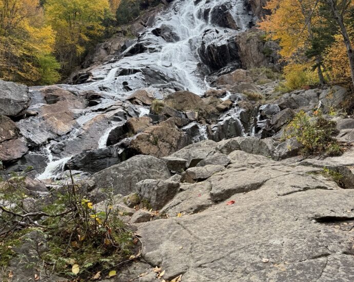 Chute Delaney waterfall at Vallée Bras-du-Nord surrounded by autumn foliage